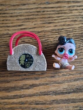 L.O.L. Surprise! Mini Doll with Gold Glitter Purse and Pink Handles